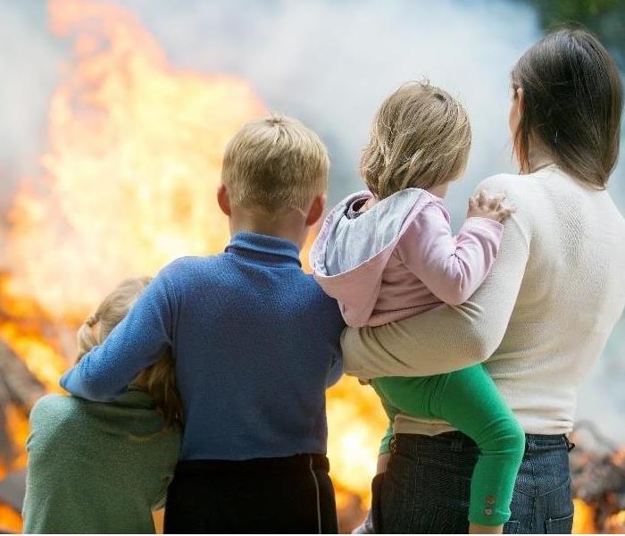 Family looking at a fire